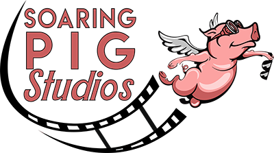 Soaring Pig Studios logo featuring a flying pig with goggles, representing creative media production, branding, and storytelling.